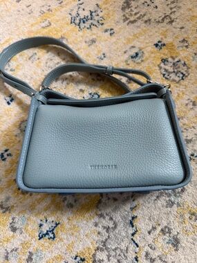 The Horse Dusty Blue Pebbled mini clementine leather Crossbody